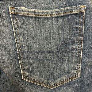American Eagle Blue Denim Jeans with Faded Look and Golden Stitching